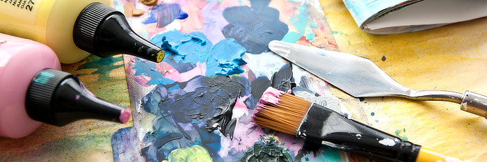 Close up of Paints, brush and a palate knife